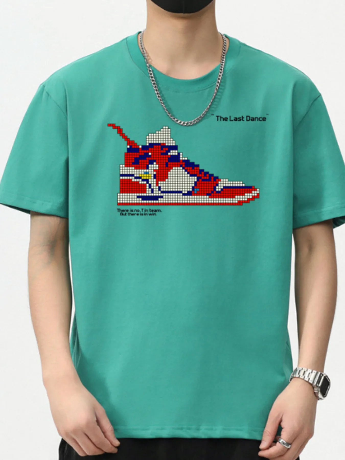 Person wearing a teal t-shirt with a graphic of a sneaker and text on a white background