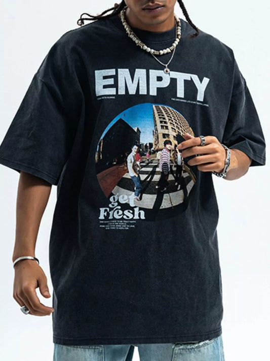 Person wearing a black t-shirt with 'EMPTY' and 'get Flesh' graphic design.