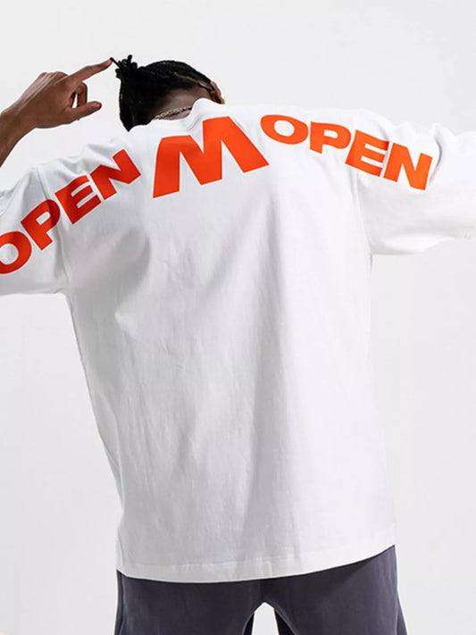 Person wearing a white shirt with 'OPEN' printed on the back against a light gray background