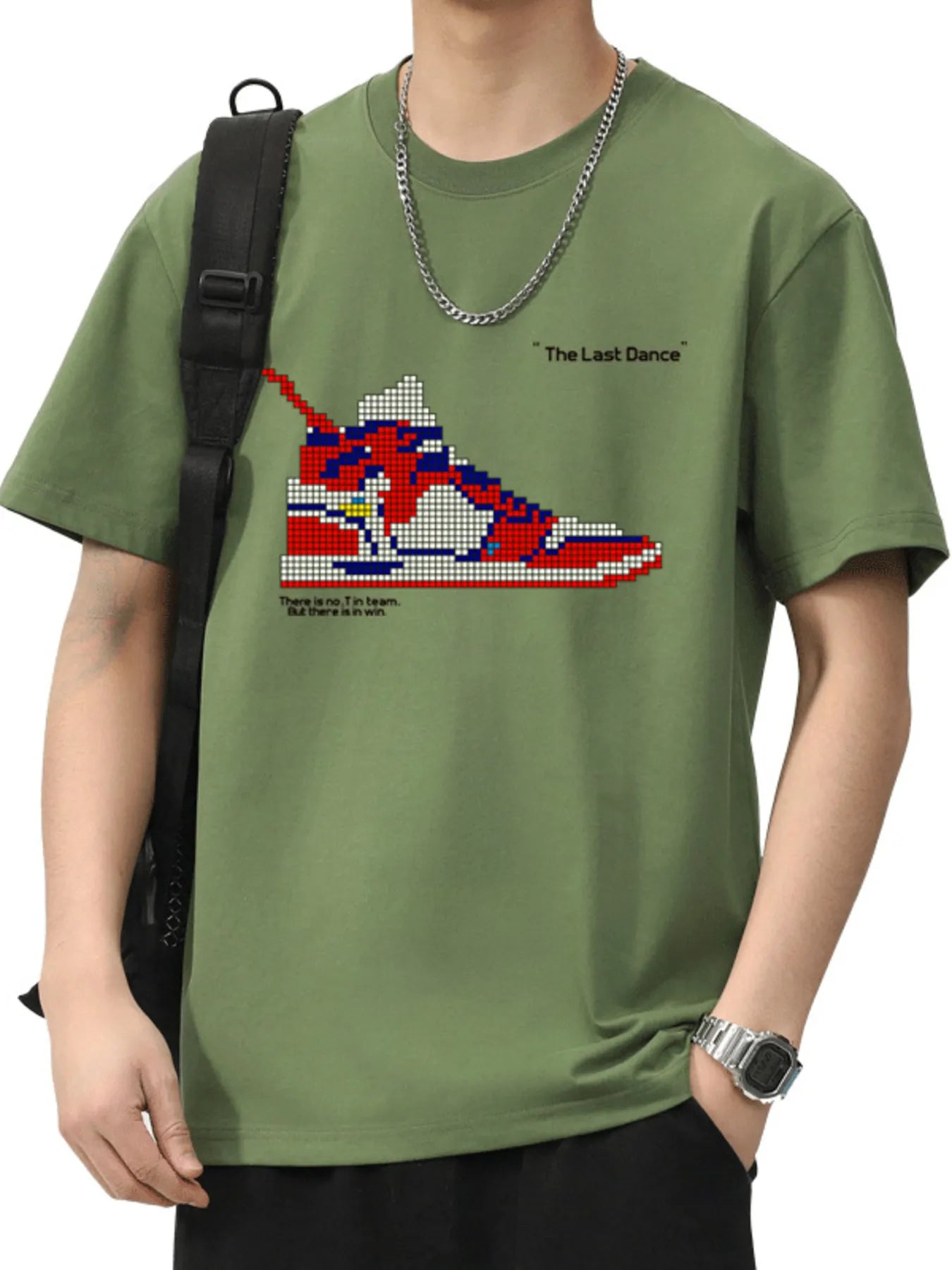 Person wearing a green t-shirt with a graphic of a sneaker design on a white background