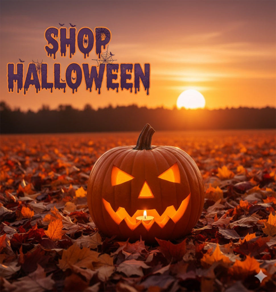 Carved pumpkin on leaves with 'Shop Halloween' text and sunset background