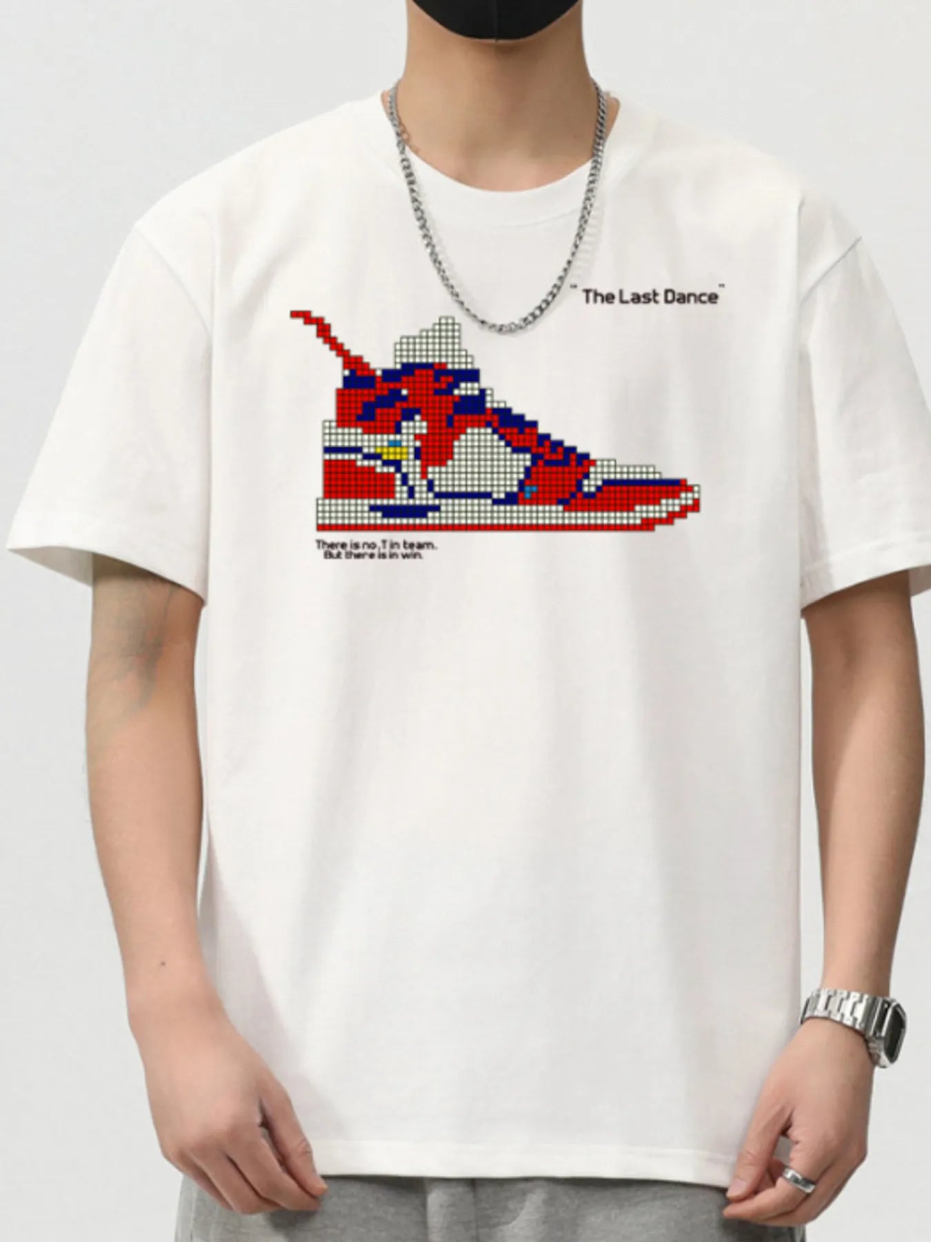 White t-shirt with pixelated sneaker graphic and text on a plain background