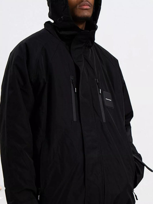 Person wearing a black hooded jacket on a white background